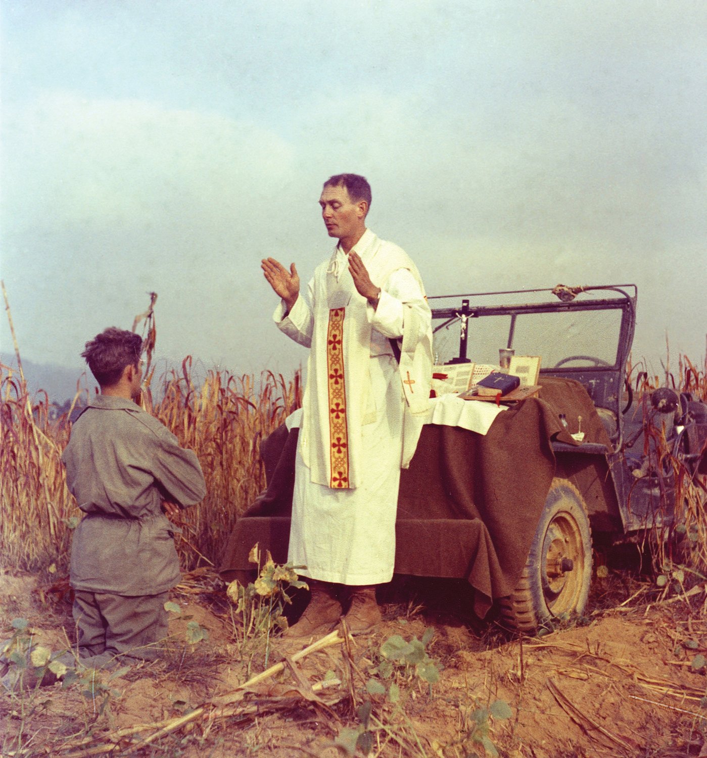 U.S. Army chaplain Father Emil Joseph Kapaun, who died May 23, 1951, in a North Korean prisoner of war camp, is pictured celebrating Mass from the hood of a jeep Oct. 7, 1950, in South Korea. He is a candidate for sainthood.